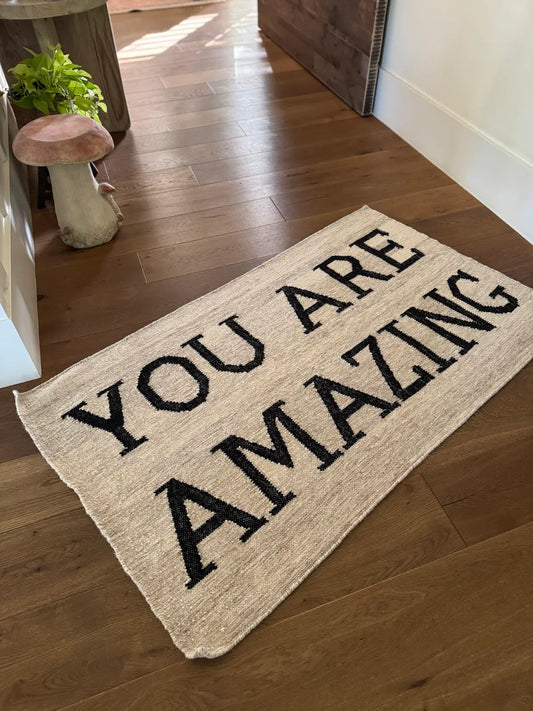 Hand-hooked wool welcome mat with YOU ARE AMAZING text, perfect for entryways