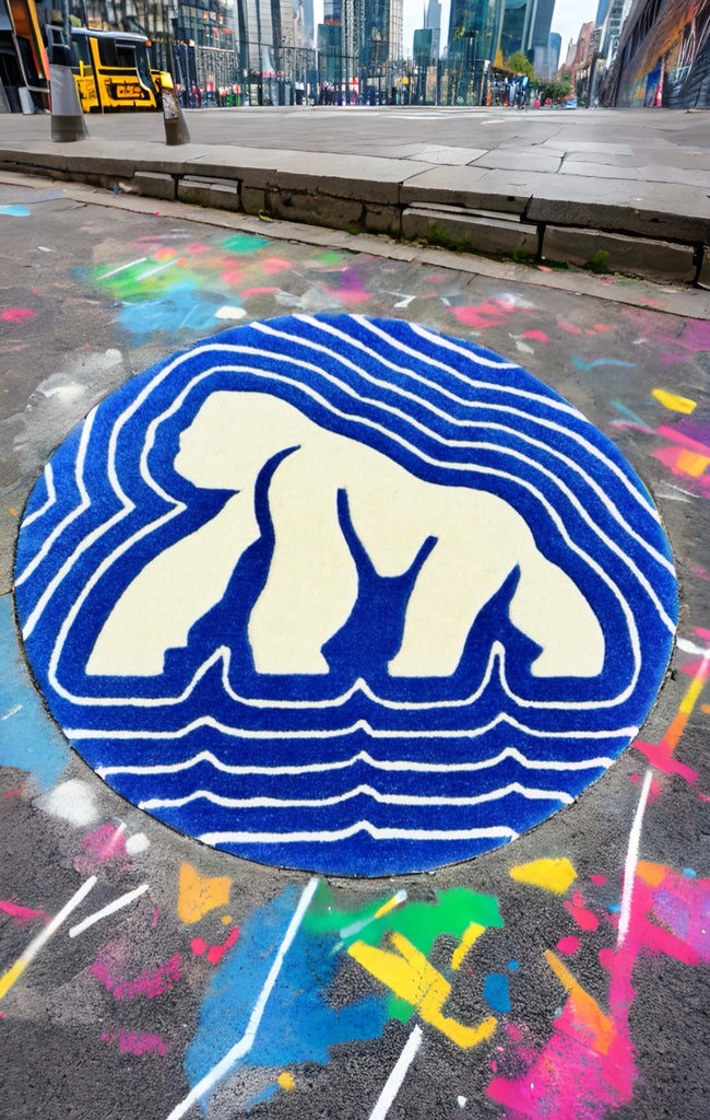 A custome made hand tufted wool round rug with a gorilla shape on the road with grafiti on the nework side walk looking extremely beautiful and eye catching