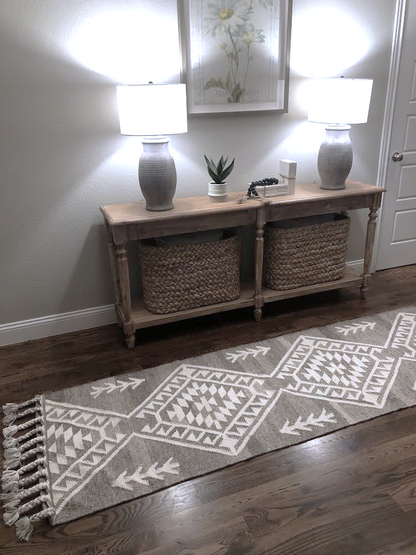 Luxury pure wool hand woven flat weave rug iwth braids in natural grey and ivory a runner n the farmhouse hallway with a beautiful decor
