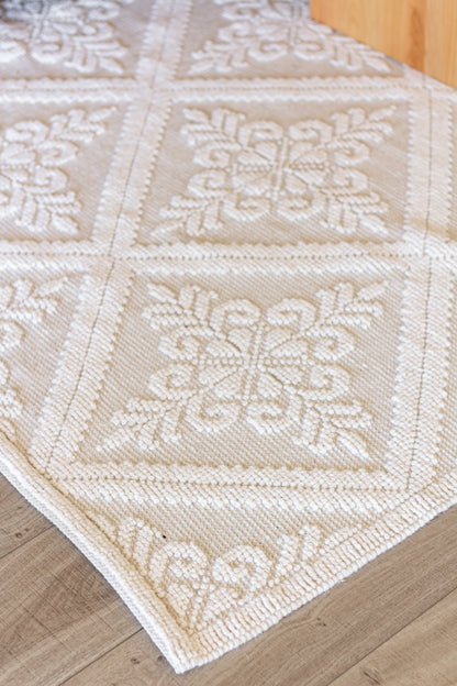 closeup of Handwoven eco-friendly wool rug with diamond pattern in farmhouse style living room