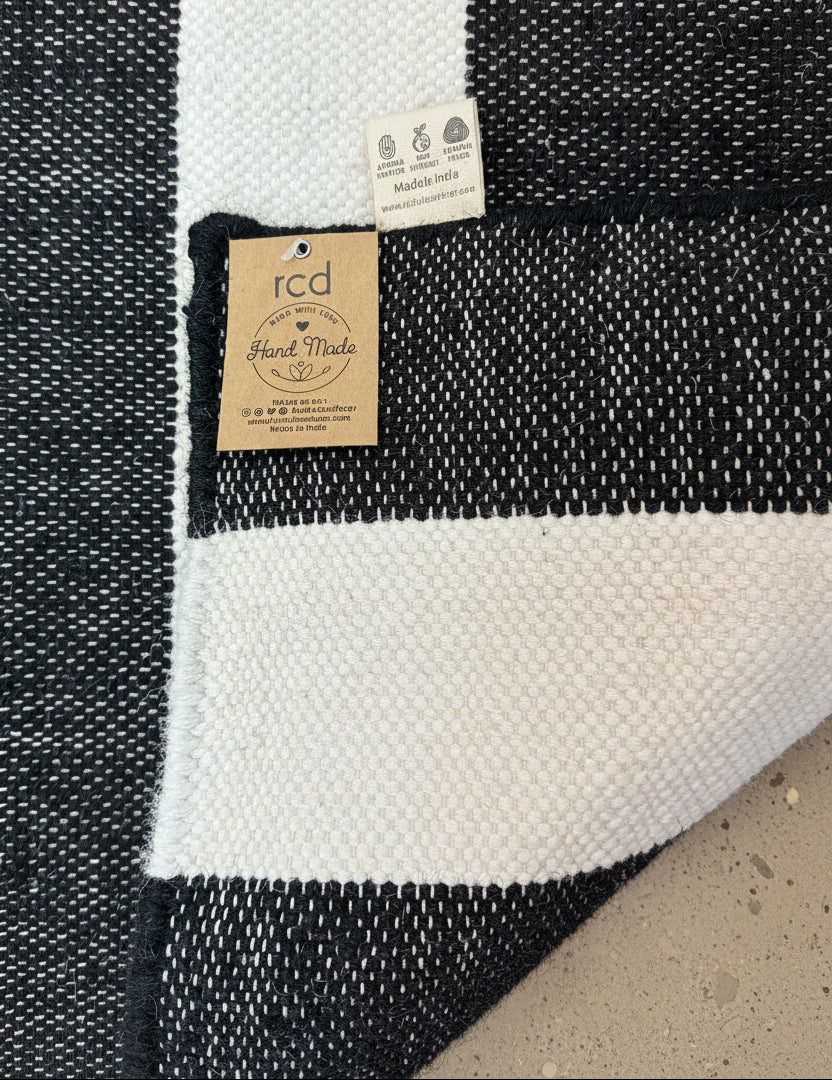 Black and white striped rug on floor