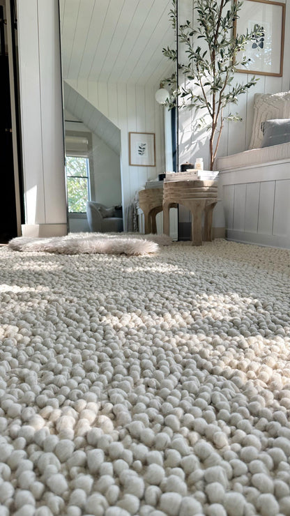 Close-up of chunky boucle weave on wool rug