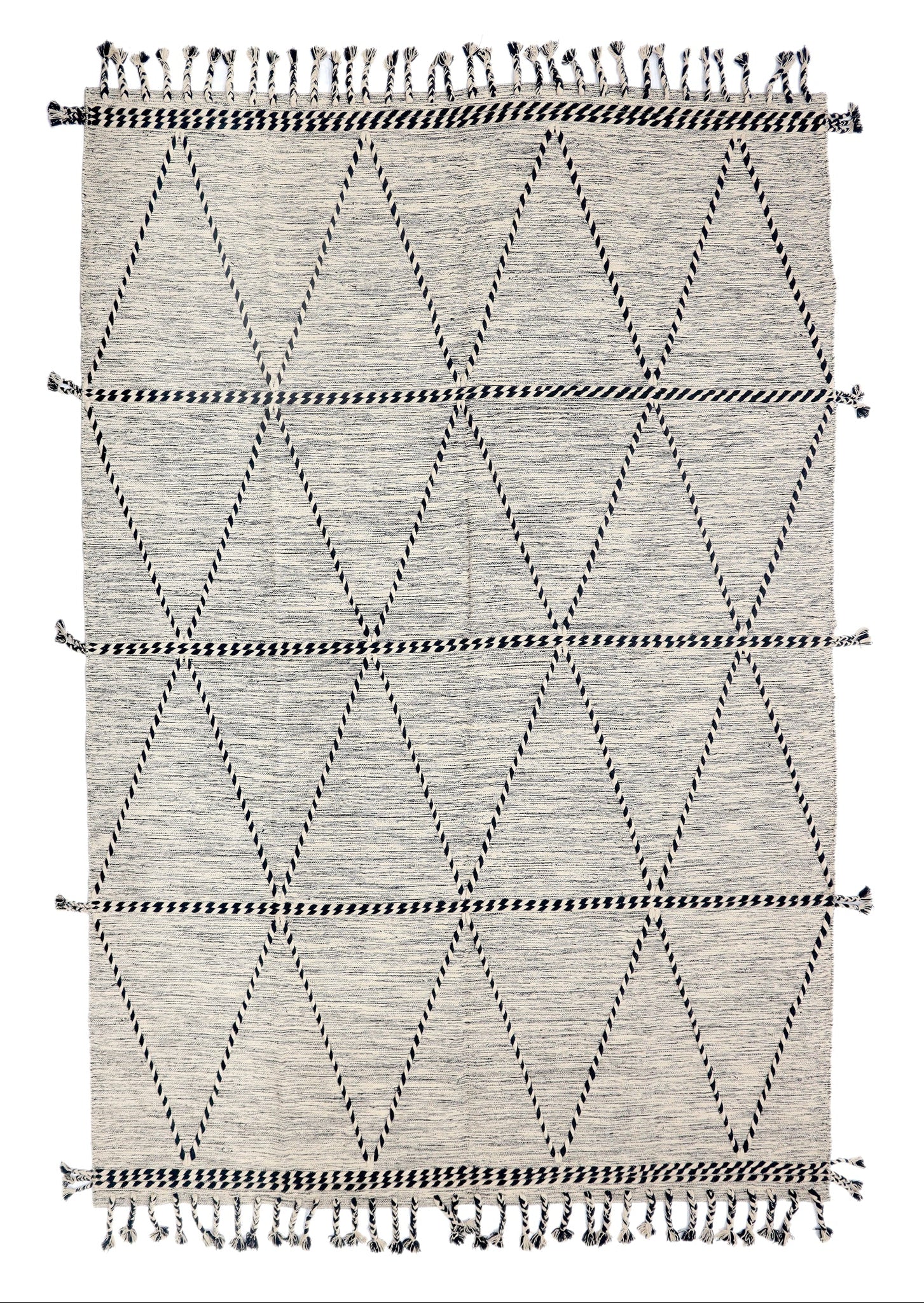 Geometric patterned rug with black and white design on a plain background