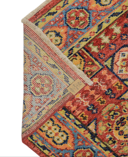 Backing of hand-knotted wool rug showing tight knot density and cotton foundation