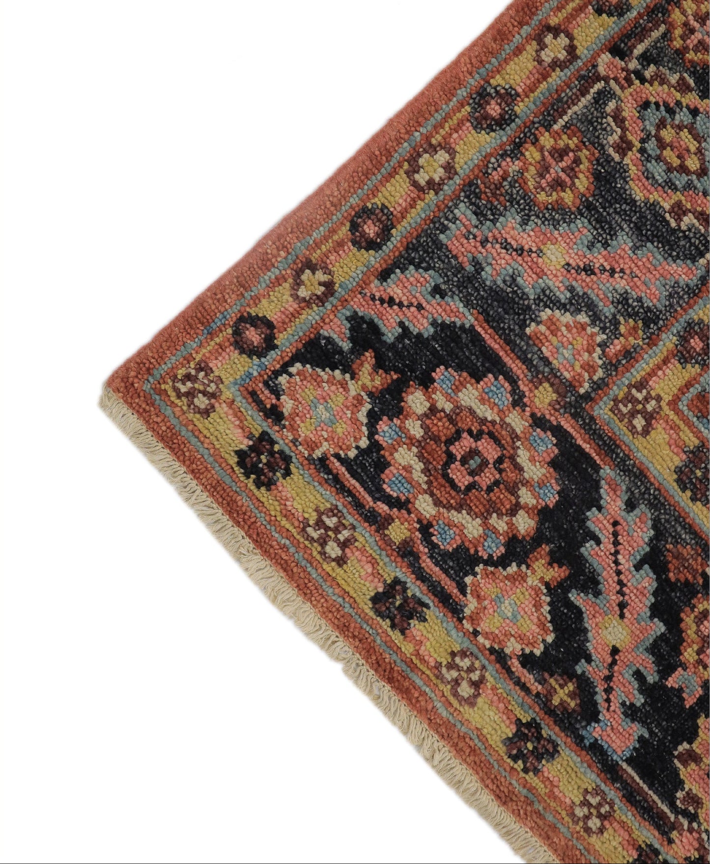 Close-up detail of hand-knotted Oushak medallion pattern — natural dye navy blue, red and ivory wool pile