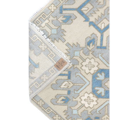 runner rug with geometric pattern on a plain background