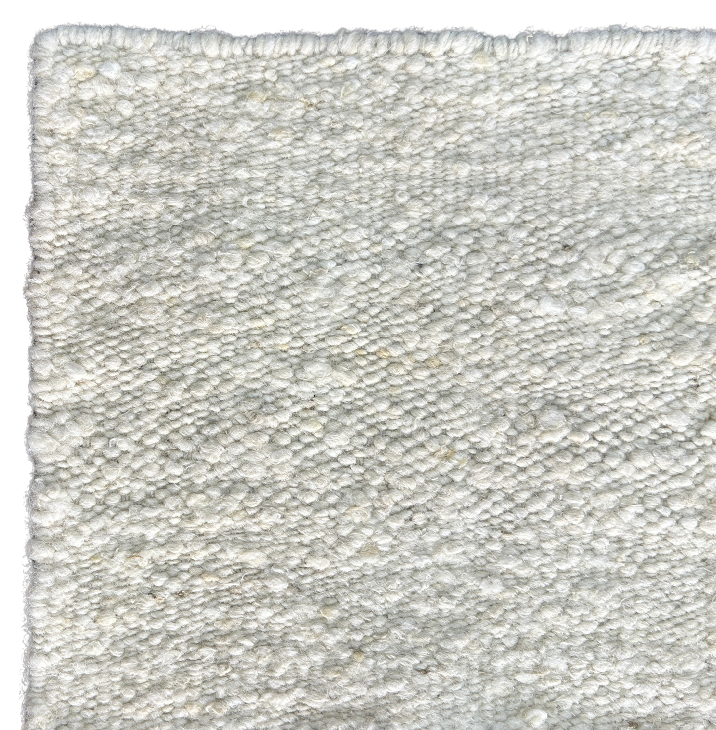 close up shot of pearl white hand woven new zealand wool rug