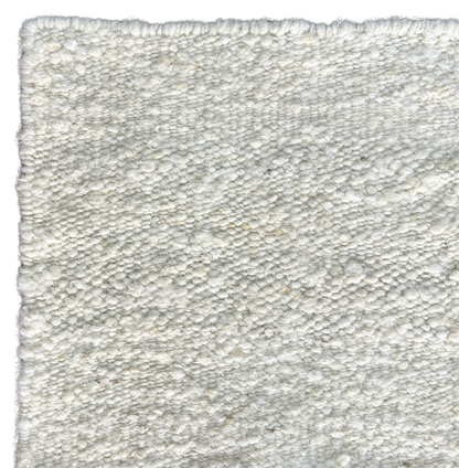 close up shot of pearl white hand woven new zealand wool rug