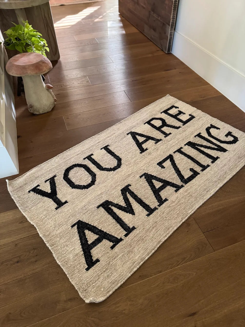Hand-hooked wool welcome mat with YOU ARE AMAZING text, perfect for entryways
