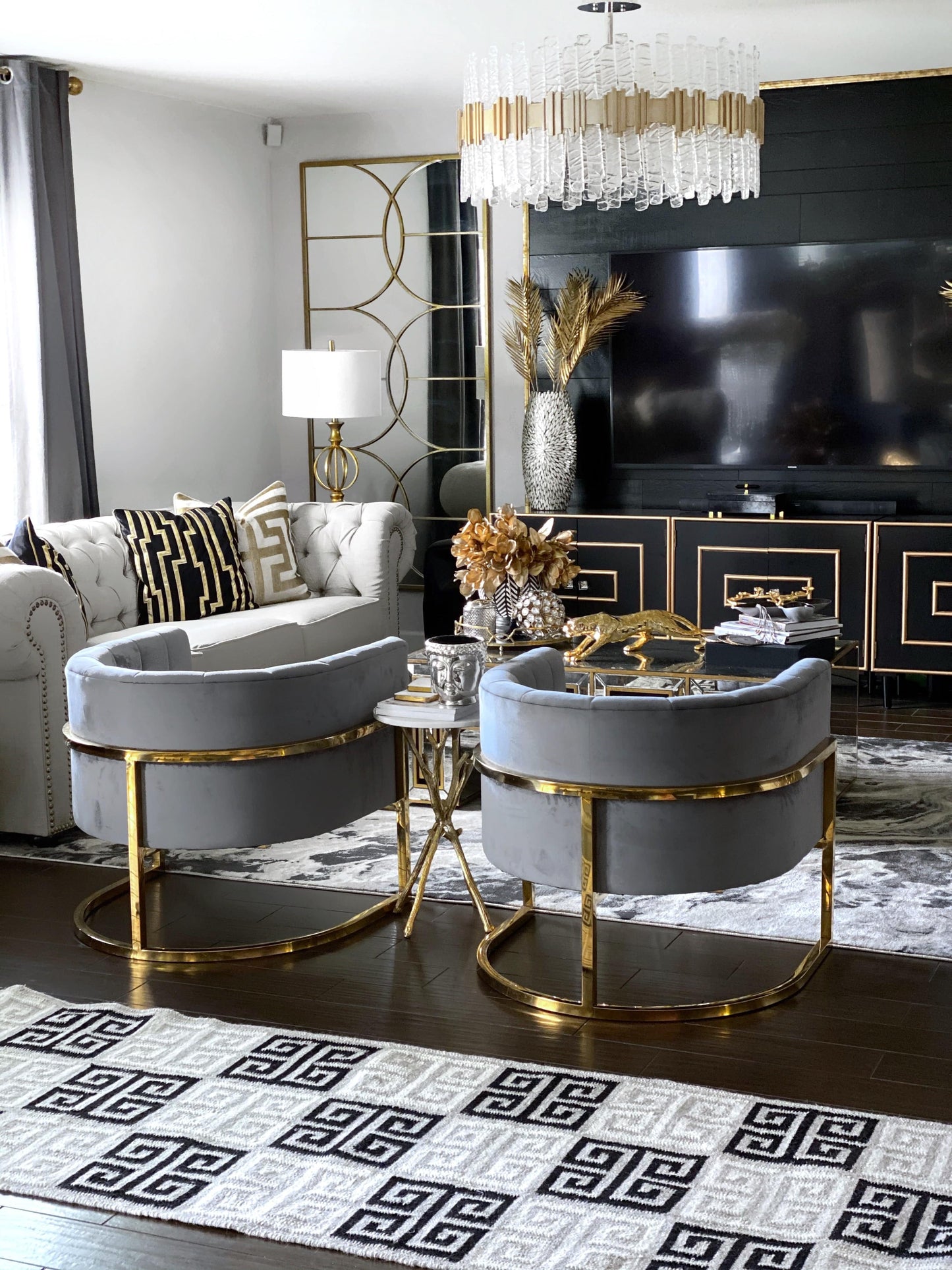 Handwoven wool rug in greek key design in a stunning glam home style room